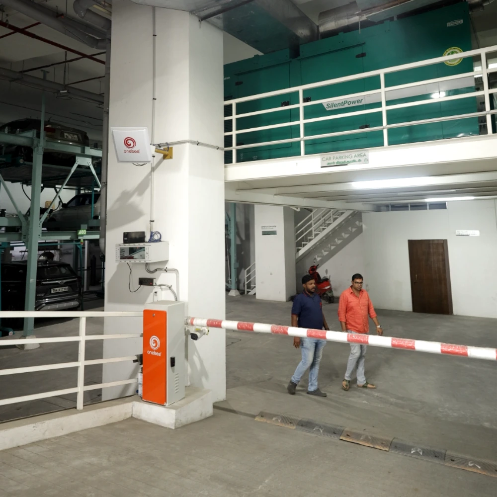 Onebee boom barrier installed for automated parking payment solutions at paid parking entrance