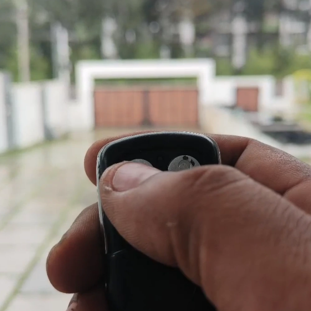 Residents using OneBee smart gate automation through mobile control for easy and safe access.